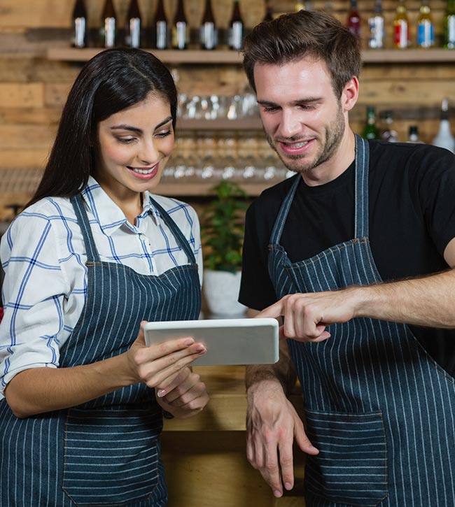 employees working together on ipad