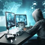 internet hacker at computer desk